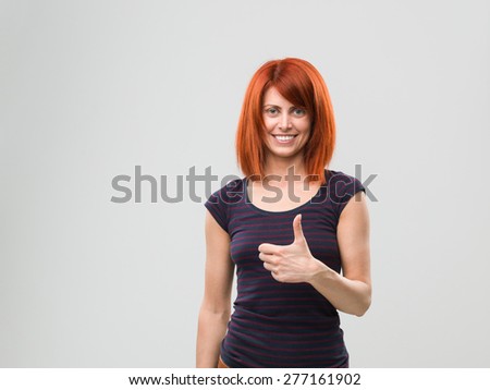 portrait of happy woman giving thumbs up. copy space available