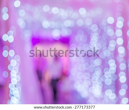 Blurred motion image of people moving to the lights gate indoor.