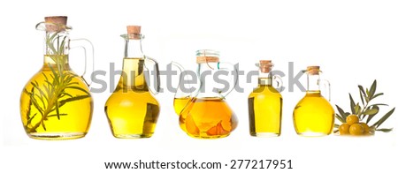 Extra virgin olive oil cruets and flavored olive oils with rosemary and garlic Royalty-Free Stock Photo #277217951