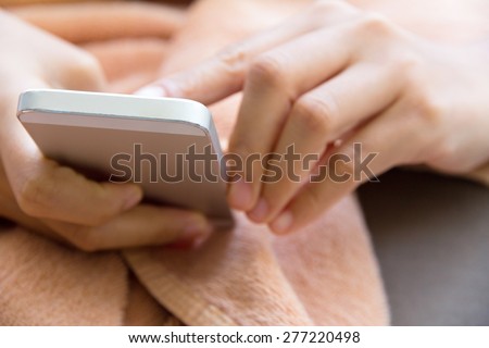 Close up image of Teenage girl text messaging on her phone