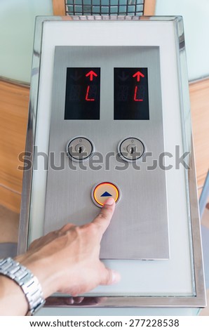 Hand touch the Elevator Button up direction