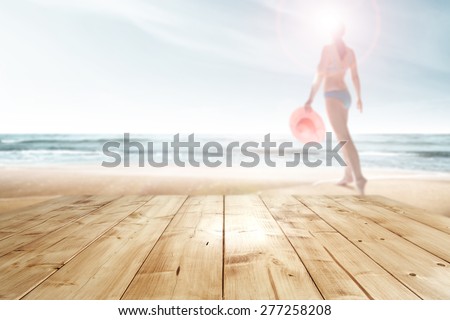 woman with pink hat on beach  and top place 