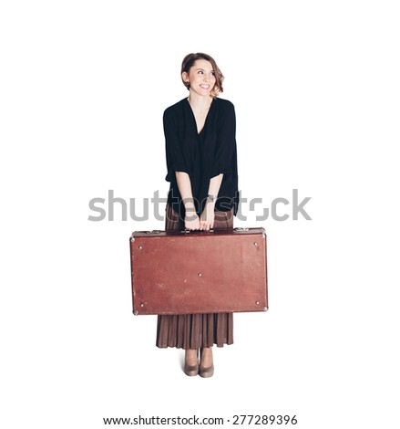 Young happy elegant business woman going on a trip with large suitcase. White background isolated