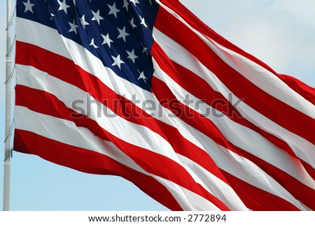 Macro shot of the American Flag waving.  (Motion).