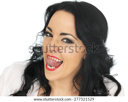 Cheeky Beautiful Young Hispanic Woman in Her Twenties Pulling Silly Faces and Sticking Out Her Tongue