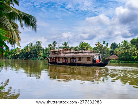 Traditional Indian houseboat near Alleppey  on Kerala backwaters, India Royalty-Free Stock Photo #277332983