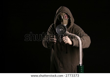 photography concepts a man in a gas mask wants to take a picture
