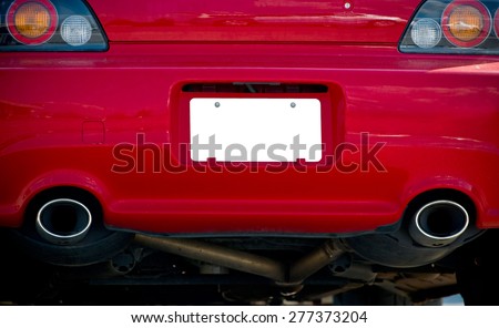 Blank License Plate On Red Car Royalty-Free Stock Photo #277373204