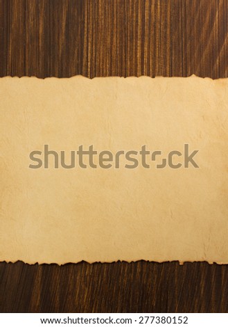 paper parchment on wooden background