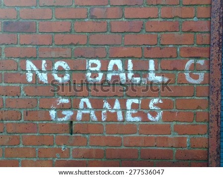 No Ball Games Hand Painted Sign on Brick Wall