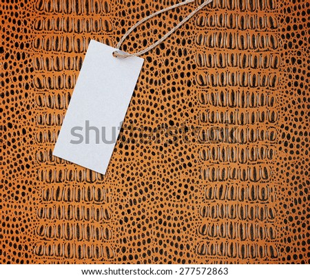 Crocodile leather texture with old paper price tag
