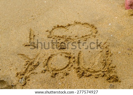 inscription in the sand - i love you