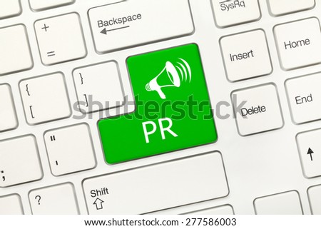 Close-up view on white conceptual keyboard - PR (green key)