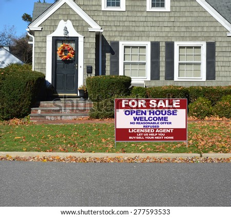 Real estate for sale open house welcome sign Close up of Beautiful Home Leaf wreath Sunny autumn day residential neighborhood USA