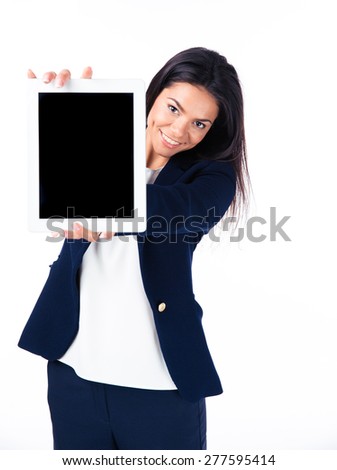 Happy businesswoman showing tablet computer screen over white background. Looking at camera