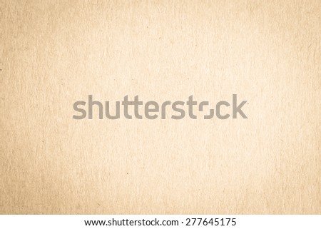 Recycled paper texture background in yellow cream brown color 