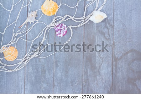 fishing net on gray wooden background with copy space