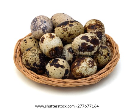 Quail eggs are isolated in basket on a white background