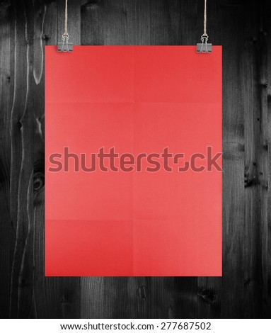 Red poster on a wood wall