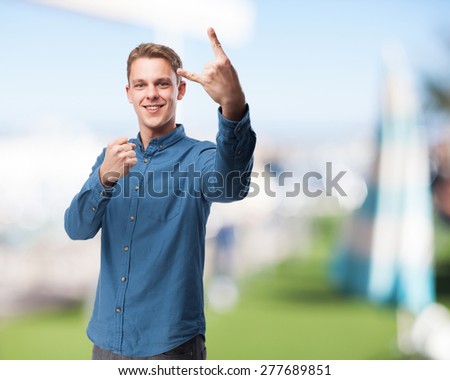 happy young man rock gesture