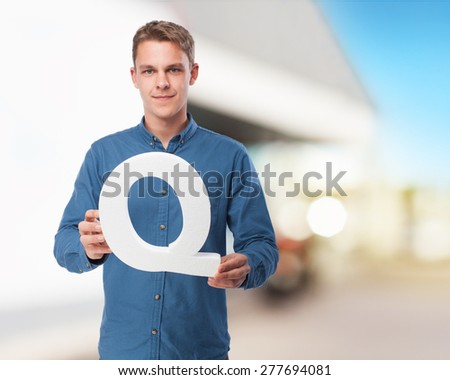 happy young man with q letter