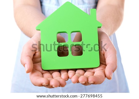 Female hands with small model of house, closeup