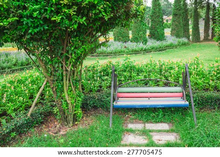 Wooden chair in green park