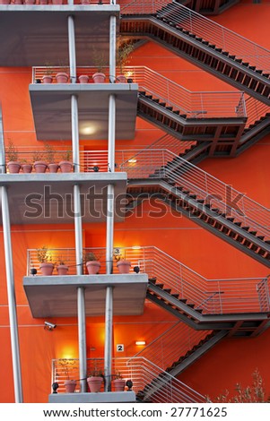 External fire escapes on an orange modern building