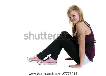 An alternative teen girl, casually posing for a picture. with the words "i love him" written on her shoe.