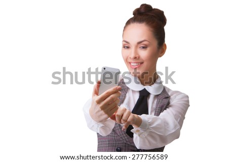 Pretty woman taking a selfie of herself on white background