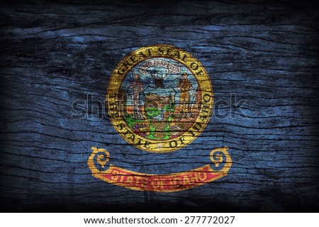 Idaho flag pattern on wooden board texture ,retro vintage style