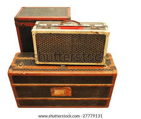 Three old suitcases isolated over white background.