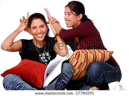 Two Young Indian Women Gossiping On White Background Stock Photos And Images Avopix Com