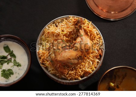 Hyderabadi Biryani is most well-known Non-Vegetarian culinary delights from the famous Hyderabad Cuisine. It is a traditional dish made using Basmati rice, goat meat and various other exotic spices. Royalty-Free Stock Photo #277814369