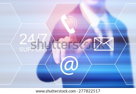 business, technology and internet concept - businessman pressing 24/7 support button on virtual screens Royalty-Free Stock Photo #277822517