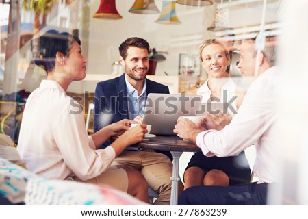 Business meeting in a cafe Royalty-Free Stock Photo #277863239