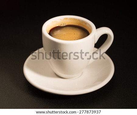 Cup of coffee on black table