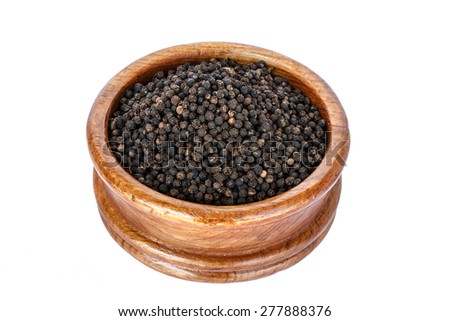 black pepper on wooden spoon with wooden plate isolated on white background.