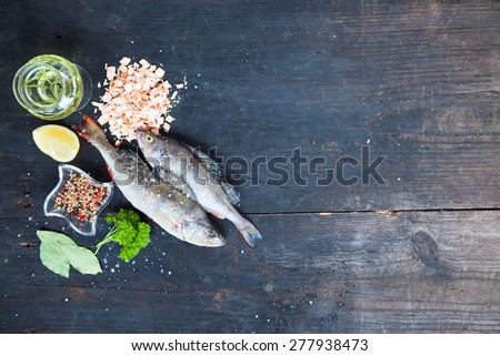 Cooking background, fish on the blackboard, top view
