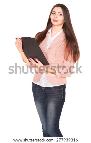 Happy young businesswoman holding clipboard on white background