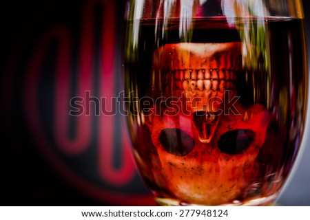 still life with skull and  grape wine on abstract background