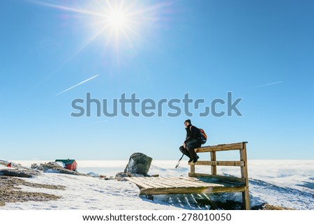 Man admiring the beauty of snowy mountains landscape 