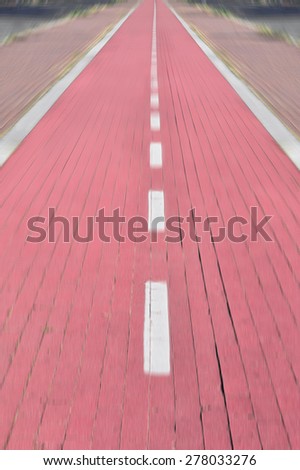 Outdoor pictures to a bike trail in perspective blur