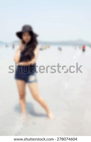 blurred woman on the beach