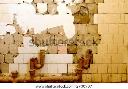 Broken old tile on wall.