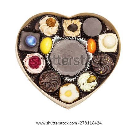 Box filled from collection chocolate candies Valentine's Day, isolated on white background