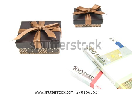 two brown gift boxes and banknotes closeup on white
