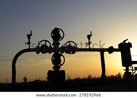 Oil pipeline valve under the setting sun 