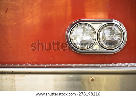 The front side of a fire engine truck with circle light