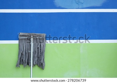 Mop on color wall